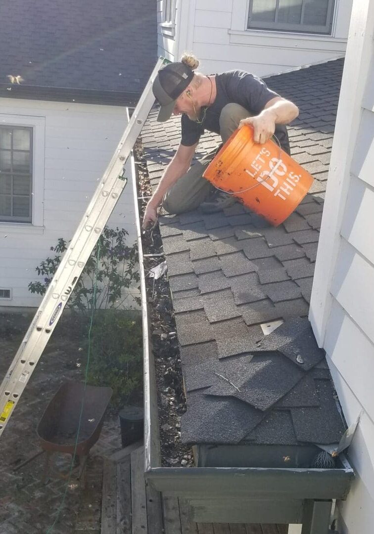 Men doing gutter repair on a property in Livermore, CA.