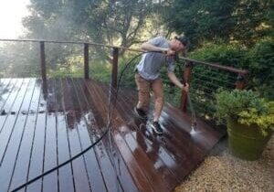 A technician working on gutter cleaning and repair.